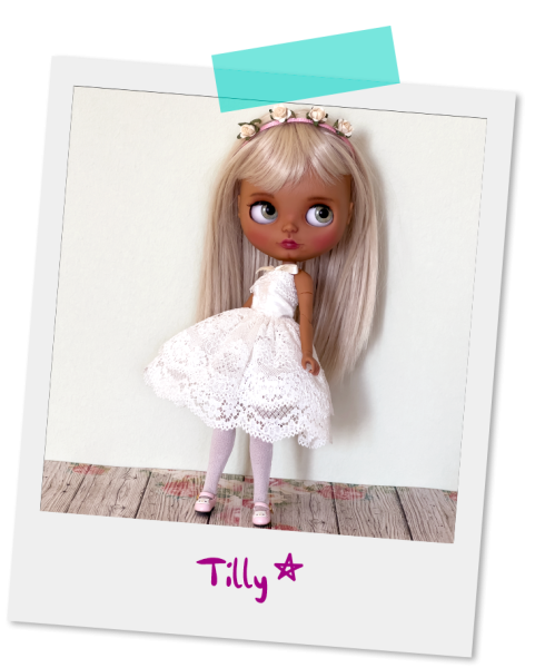 A polaroid picture of the Tilly custom Blythe doll
